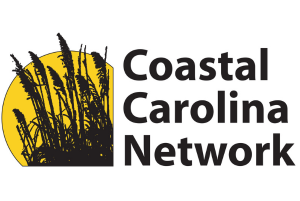 Logo of coastal Carolina network supporting local businesses, featuring stylized black reeds against a yellow background with black text.