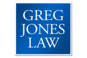 Logo of Greg Jones Law featuring white text on a blue background, enclosed in a white border, symbolizing community support.